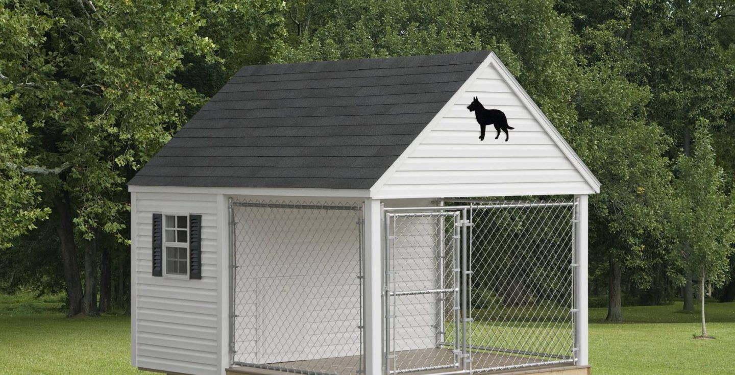 white outdoor dog kennel in a backyard