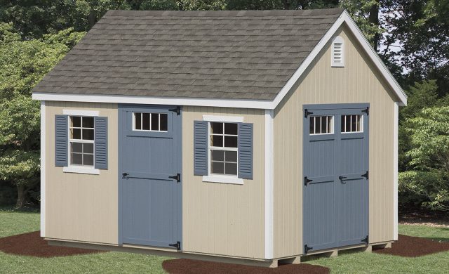 tan new england style shed with blue doors and trimmings