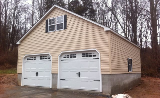 two story yellow two car garage