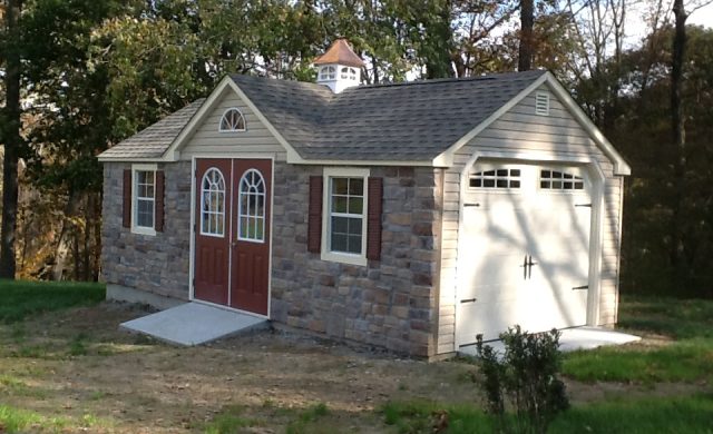 large stone 1 car garage and storage shed